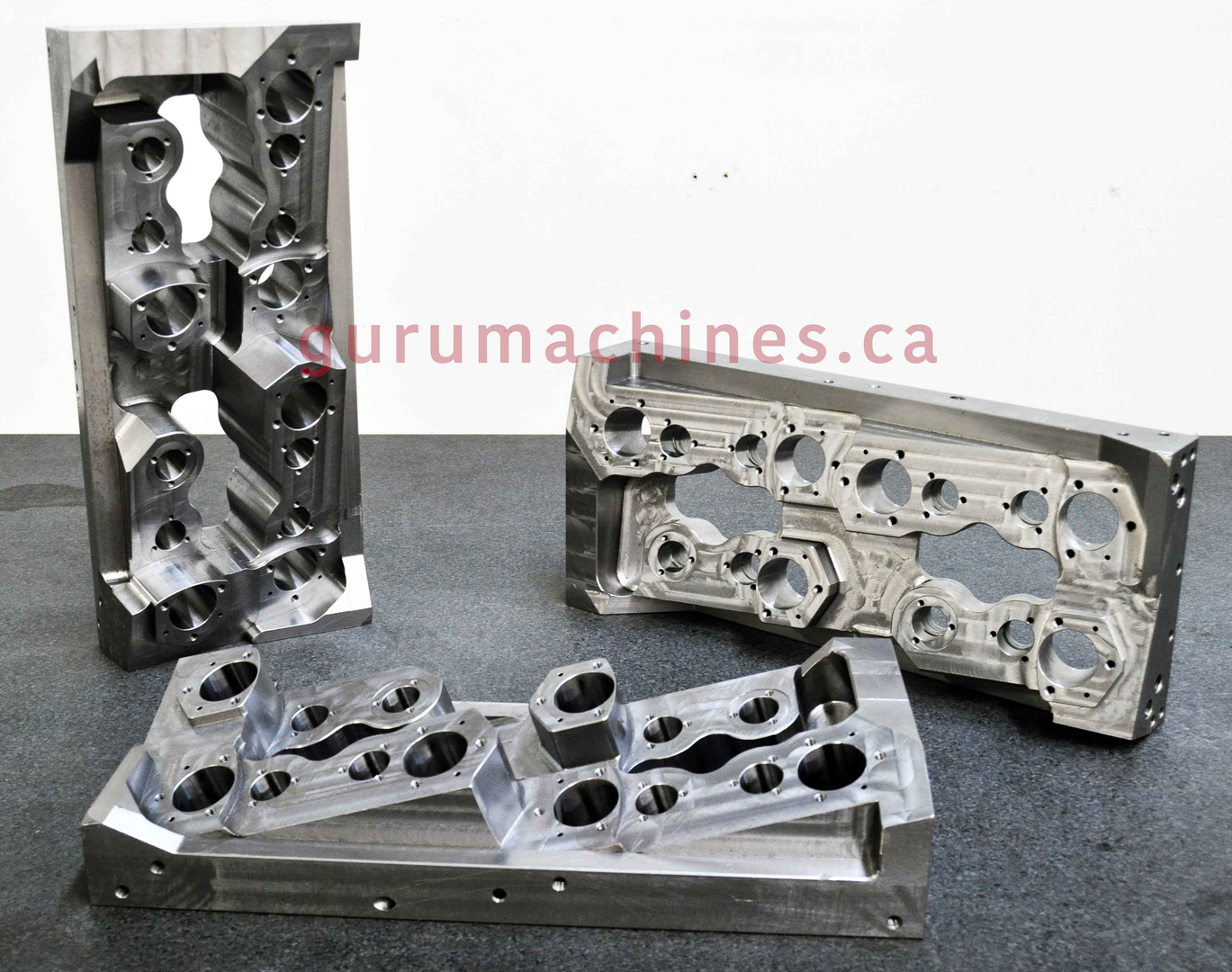 Three heavy machined aluminum housings